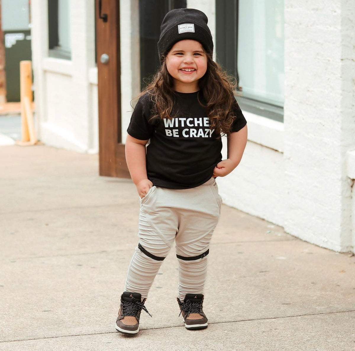 Boys Halloween graphic tee with Witches Be Crazy saying on black shirt for toddler and youth fall outfits.