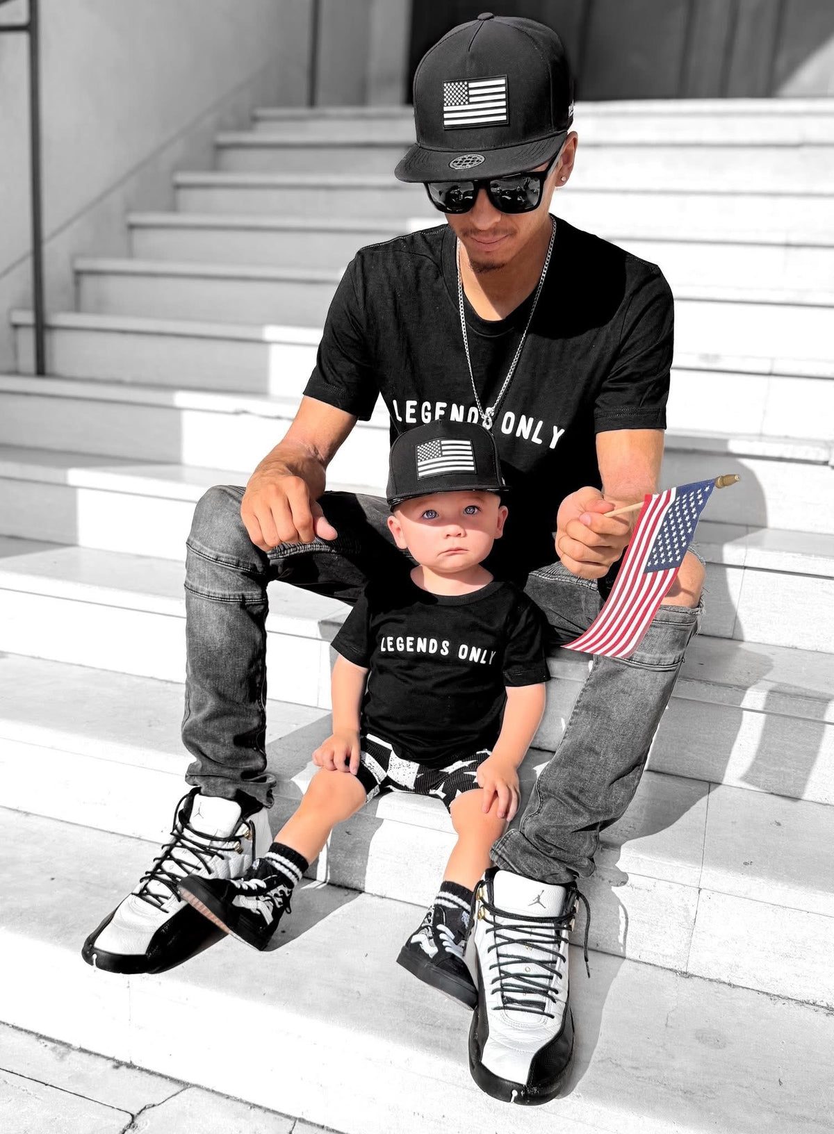 Toddler boy wearing Legends Only trendy black graphic tee