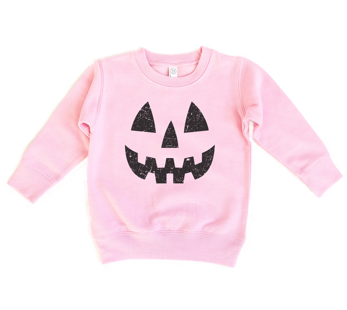 Pink sweatshirt with black jack-o'-lantern face design on a white background